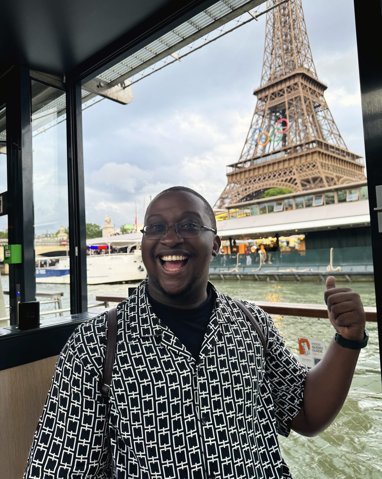 Joshua in front of the Eiffel Tower